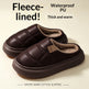 A pair of dark brown fleece-lined slipper shoes with thick soles, shown on a light beige background with promotional text highlighting waterproof PU and warm fleece lining.