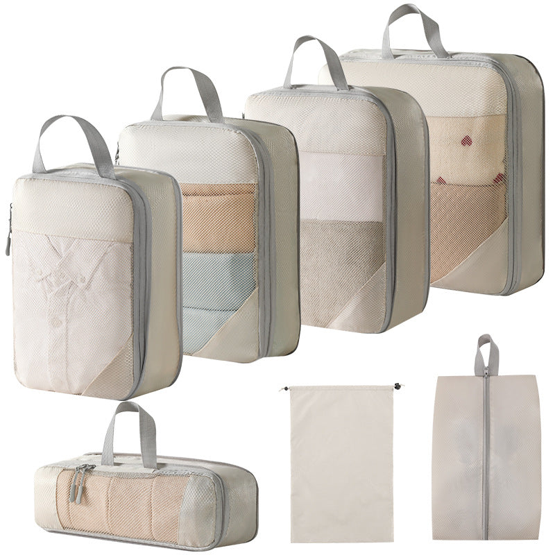 Compression packing cubes set showing organized clothes inside luggage
