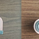 Two hairbrush components on a wooden surface