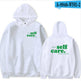 White hoodie with 'self care.' text on front and back, displayed on a white background.