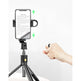 Phone holder with tripod and hand adjusting it on a white background