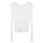 White long-sleeve crop top on a white background