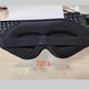 Black sleep mask on a desk with '3pcs' text