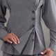 Gray suit jacket with buttons on a plain background