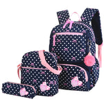 Polka dot backpack set with pink accents on a white background