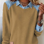 Brown sweater with denim collar and cuffs worn by a person.