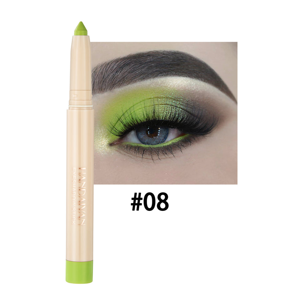 Green eyeliner pencil with eye makeup application on a white background