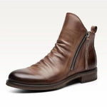 Brown leather ankle boot with a zipper on a white background