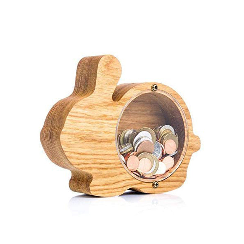 Wooden piggy bank with coins inside on a white background