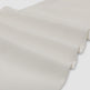Close-up of beige fabric texture on a white background
