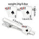 Cufflinks and tie clip with playing card design on a white background