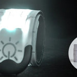 Reflective safety wristband with embedded light on a dark background
