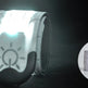 Reflective safety wristband with embedded light on a dark background
