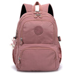 Pink backpack with a visible brand logo on a white background