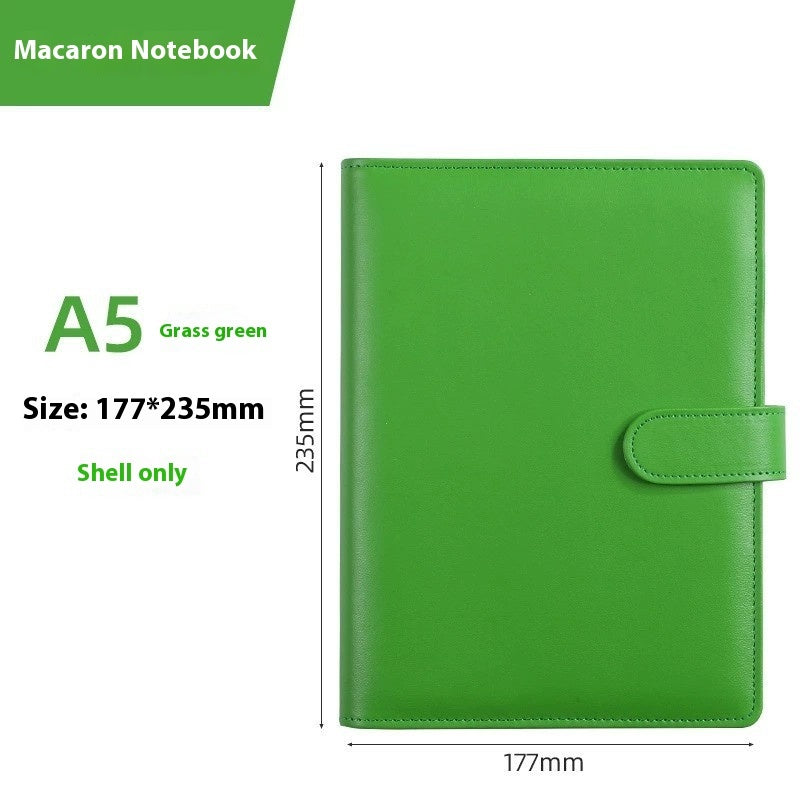 Green notebook with dimensions labeled on a white background