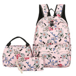Floral-patterned backpack and lunch bag set on a white background