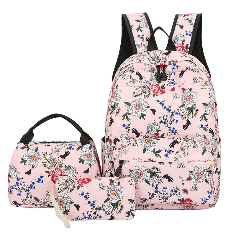 Floral-patterned backpack and lunch bag set on a white background