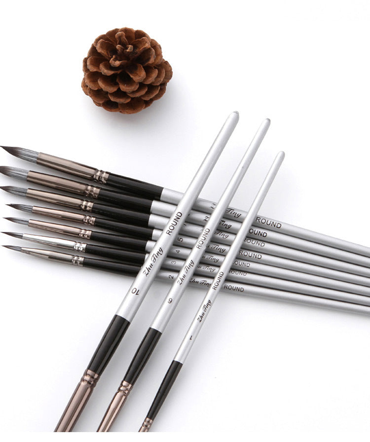 Set of paintbrushes with 'Manly' branding on a white background with a pine cone.