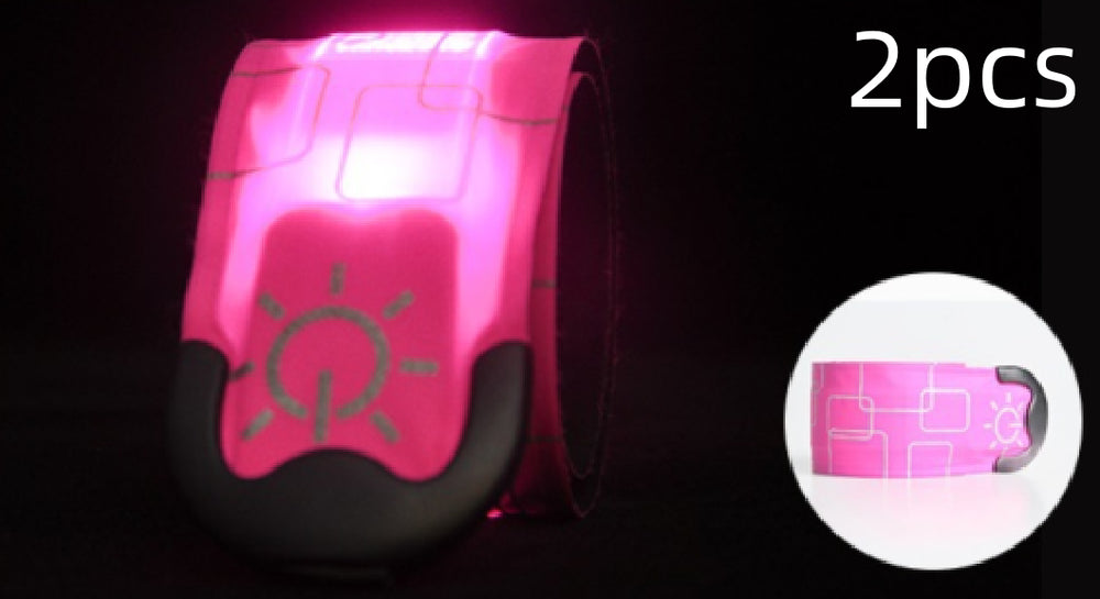 Pink LED wristband with power symbol on a black background, labeled '2pcs'.