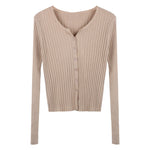 Beige ribbed sweater with buttons on a white background