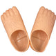 A pair of peach-colored silicone foot-shaped molds or molds for foot exercises, shown against a plain white background.