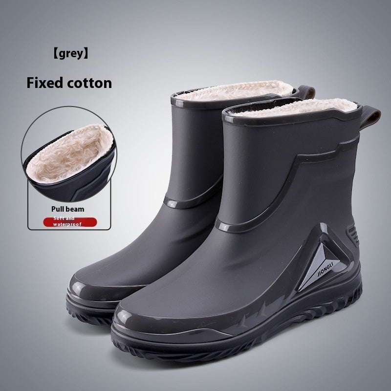 Gray rubber boots with white lining on a gray background