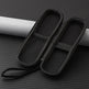 Black mesh shoe bag on a textured gray surface