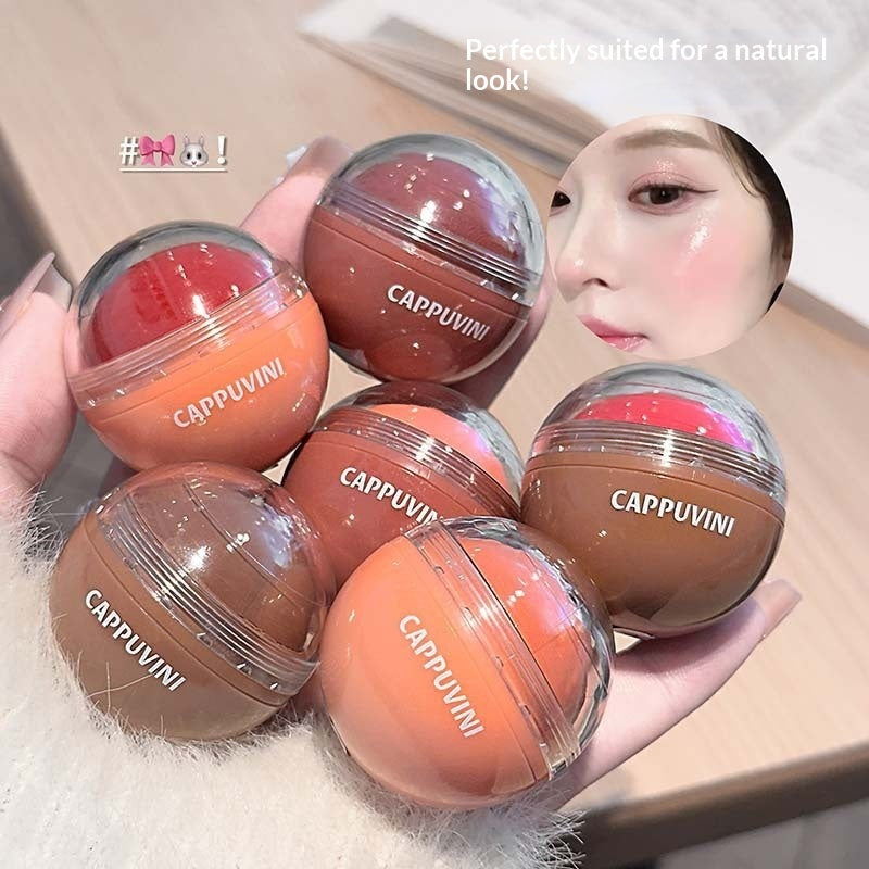 Lip balm containers with 'Cappuvini' branding held by a hand.