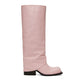 Pink knee-high boot with a black sole on a white background