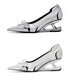 White high-heeled shoes with black accents on a white background