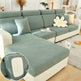 Green sectional sofa with a close-up of the fabric texture in a living room setting.
