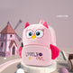 Pink owl-shaped backpack with 'Lovely Owl' text on a white background