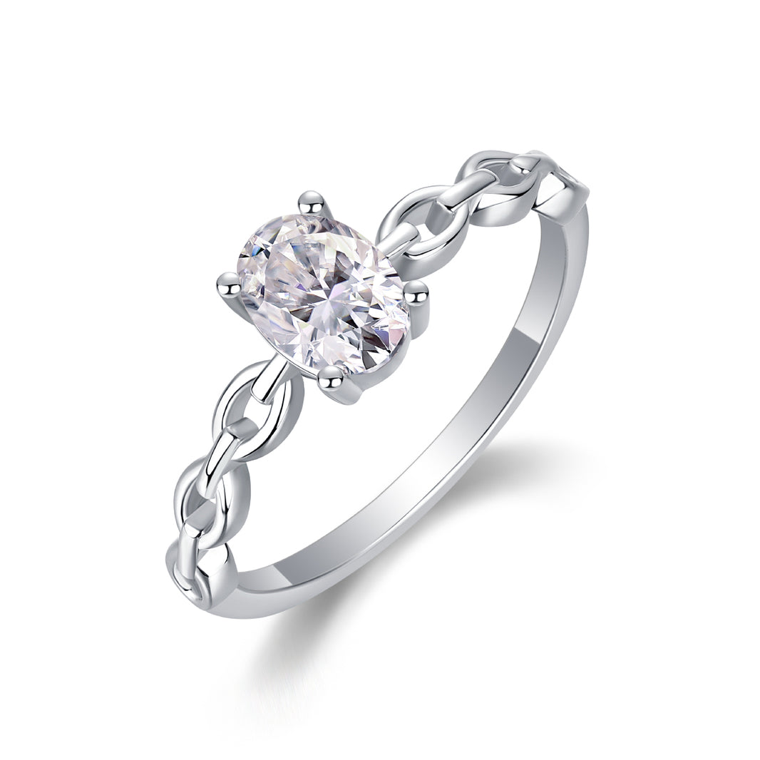 Silver ring with a heart-shaped diamond on a white background