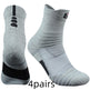 Two gray socks with black accents on a white background, labeled '4 pairs'.