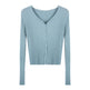 Light blue ribbed knit cardigan on a white background