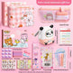 Entry-level stationery gift box with various items on a pink background