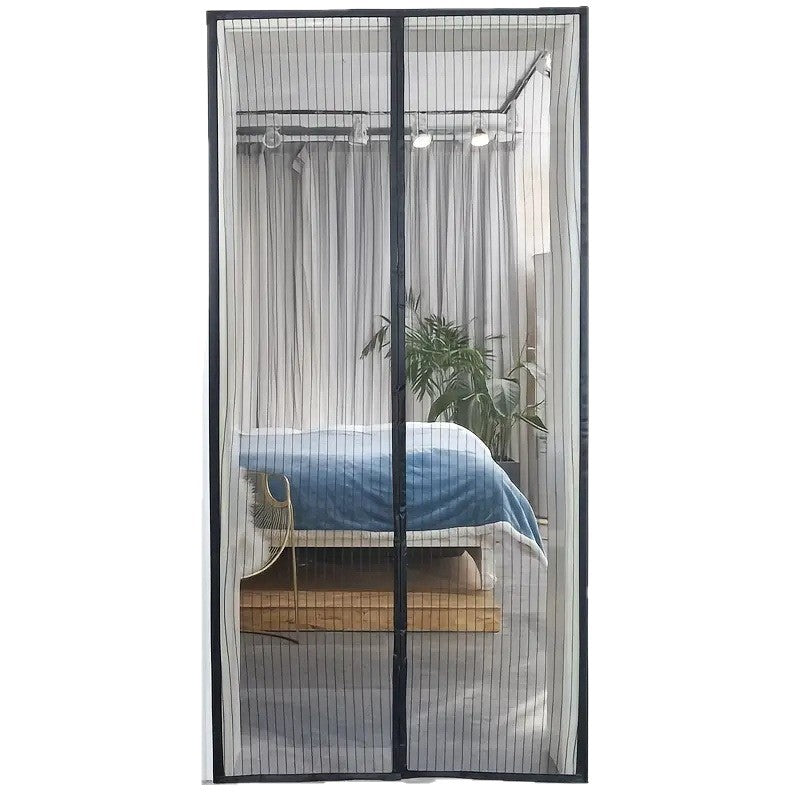 Magnetic screen door covering a bedroom with a bed and plant.