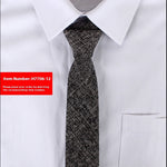 White shirt with a black patterned tie on a white background, item number H7706-12 displayed.