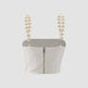 White top with pearl straps on a light gray background