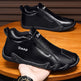 Black shoes with 'Daap' branding on a wooden surface