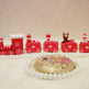 Decorative train set with small figures on a beige background