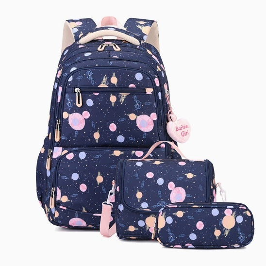 A matching backpack, pouch, and pencil case set in navy blue with a colorful space print of planets, stars, and pink planets, shown on a clean white background.