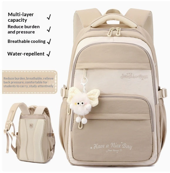 A beige and cream multi-layer backpack shown on a white background with feature callouts and a small inset side view. The backpack has a front zip pocket, top handle, shoulder straps, and a fluffy white bunny charm hanging from the zipper.