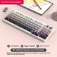 Mechanical keyboard with RGB lighting on a light pink surface, featuring text about its features.