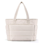 Beige tote bag with multiple pockets on a white background