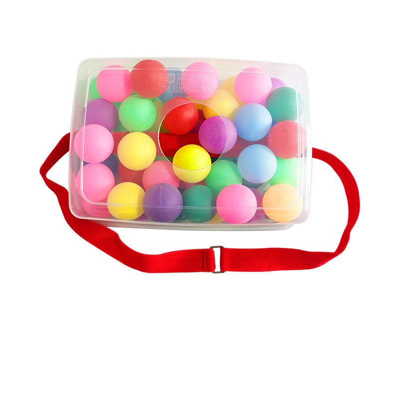 Clear container with colorful balls and a red strap on a white background