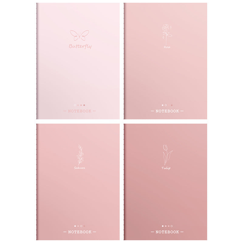 Four pink notebooks with different designs on the covers against a white background