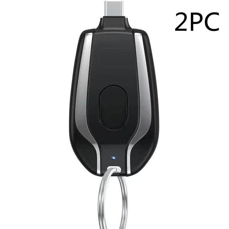 Black car key fob with silver accents on a white background, labeled '2PC'.