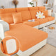 Orange sectional sofa with a close-up of the fabric texture in a living room setting.