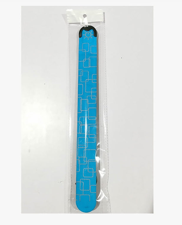 Blue sandal with geometric pattern in clear packaging on a white background